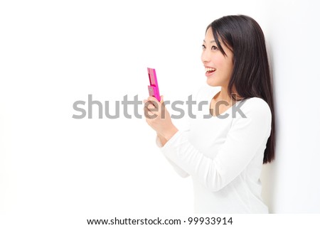 Young woman talking by mobile phone. Portrait of asian woman.