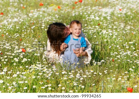mother and child in flower field