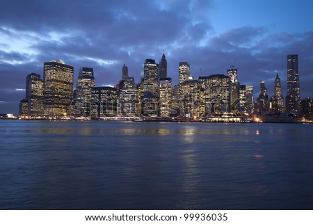 A view of downtown New York City at night from Brooklyn across the East River