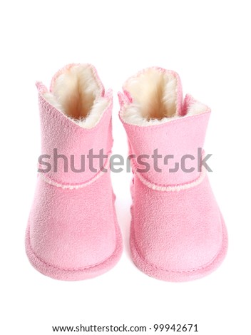 Pair of pink winter boots over pure white background