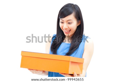 a beautiful woman smiling and holding gift box , isolated on white background