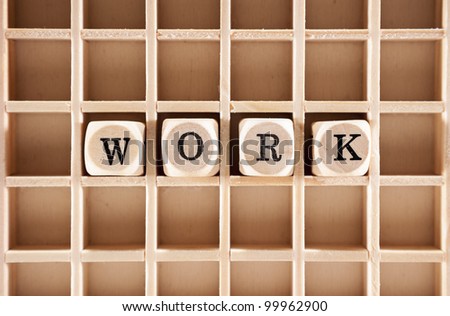 Work word construction with letter blocks / cubes and a shallow depth of field