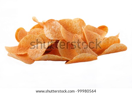 Potato crisps strewn with ground paprika and the pepper incommunicado on the white background
