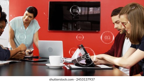 Image of 6g texts in bubbles over diverse coworkers analyzing reports in office. Digital composite, multiple exposure, business, planning, telecommunication, teamwork and technology concept. - Powered by Shutterstock