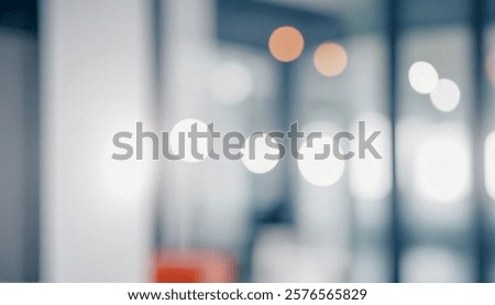 Image is an abstract blurred representation of a modern office interior with bokeh effects showcasing light and space.