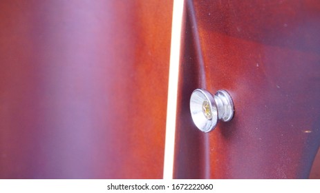 Image Of An Acoustic Guitar Strap Hanger