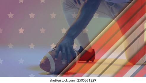 Image of african american american football player kneeling with ball and flag of usa. American patriotism, sports and competition concept digitally generated image. - Powered by Shutterstock