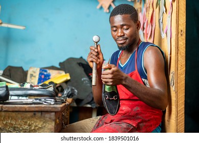 image of african man, with foot wear-workshop concept - Powered by Shutterstock