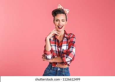 Image of amazing happy young pin-up woman isolated over pink background wall looking camera.