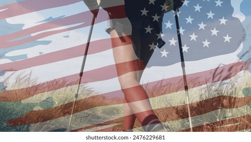 Image of american flag over biracial woman hiking in mountains. patriotism and celebration concept digitally generated image. - Powered by Shutterstock