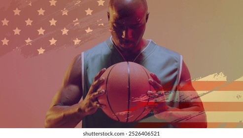 Image of american flag over focused african american male basketball player holding ball. Sport, competition, confidence, flag, team, game, nationality and patriotism digitally generated image. - Powered by Shutterstock