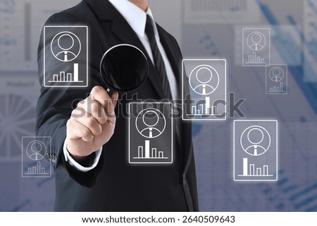 Image of analyzing various human resource characteristics with a magnifying glass