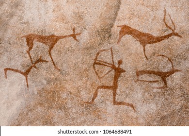 image of the ancient hunt on the wall of the cave ocher. historical art. archeology.