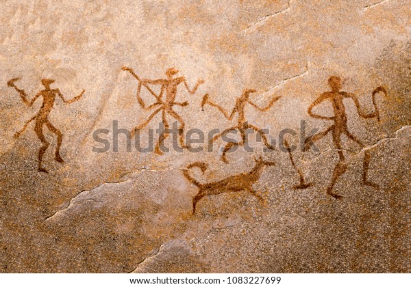 image of ancient hunters with a dog on the wall of the cave. ancient art, history, archeology.