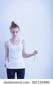 Image Of Anorexic Girl Measuring Her Waist