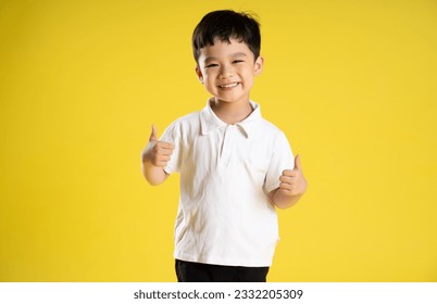 image of asian boy posing on a yellow background
 - Powered by Shutterstock