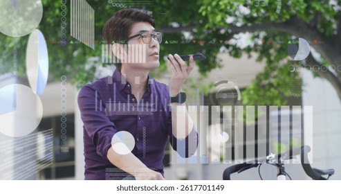 Image of asian businessman talking on smartphone over data processing. global business, finances, connections and digital interface concept digitally generated image.