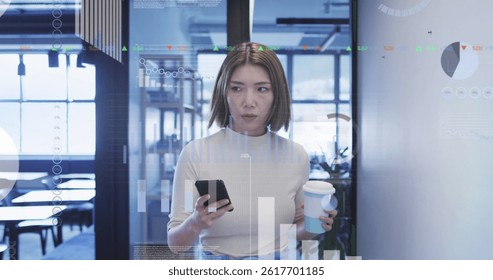 Image of asian businesswoman using smartphone over data processing. global business, finances, connections and digital interface concept digitally generated image.