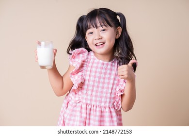 Image Of Asian Child Drinking Milk On Background