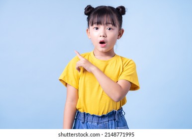 Image of Asian child posing on blue background - Shutterstock ID 2148771995