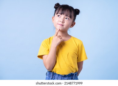 Image of Asian child posing on blue background - Shutterstock ID 2148771999