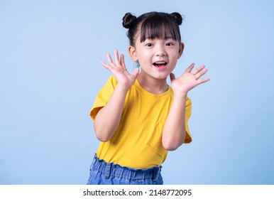 Image of Asian child posing on blue background - Shutterstock ID 2148772095