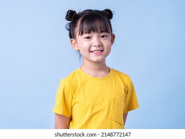 Image of Asian child posing on blue background - Shutterstock ID 2148772147