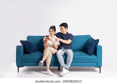 Image of an Asian couple posing on a white background - Powered by Shutterstock