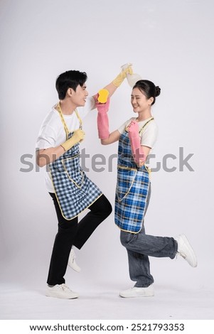Image of Asian couple posing on white background
