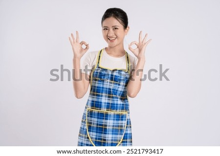 Image of Asian couple posing on white background
