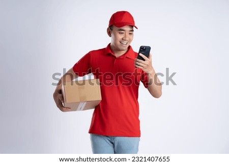 image of asian delivery man using phone on white background