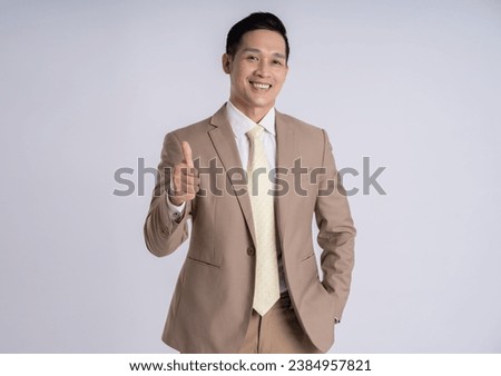 Image of Asian male businessman posing on white background