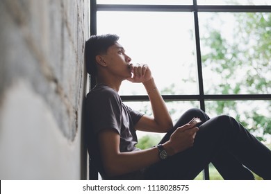 Image Of Asian Man Is Lonely Sad Worry Concept.