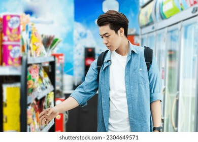 image of Asian man shopping at a convenience store