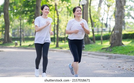 Image of Asian mother and daughter exercise at park - Powered by Shutterstock