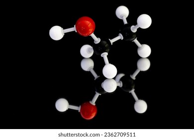 Image of atomic structure model of ethanol alcohol with blurred mirror reflection and black background