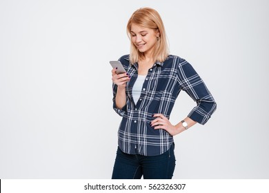 Image Of Attractive Young Woman Holding Phone Isolated On A White Background.