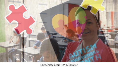 Image of autism awareness month text over diverse schoolchildren and teacher using tablet. autism awareness month and celebration concept digitally generated image. - Powered by Shutterstock