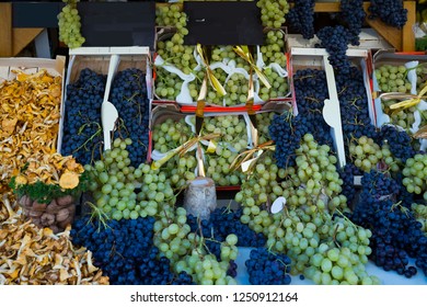 Image Of Autumn Goods- Grapes And Chanterelles On The Counter, No People