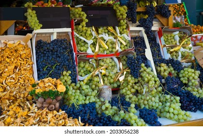 Image Of Autumn Goods- Grapes And Chanterelles On The Counter, No People