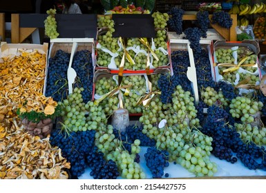 Image Of Autumn Goods- Grapes And Chanterelles On The Counter, No People