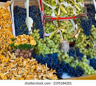 Image Of Autumn Goods- Grapes And Chanterelles On The Counter, No People