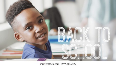 Image of back to school text over happy african american schoolboy at school. Education, learning and school concept digitally generated image. - Powered by Shutterstock