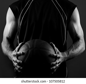 Image of a basketball player holding a ball