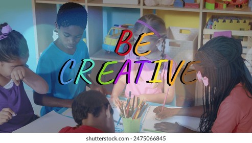 Image of be creative text over diverse schoolchildren drawing. children's art week, education and digital interface concept digitally generated image.