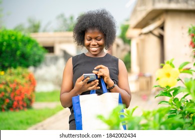 Image Of Beautiful African Lady, With Phone- Out Door Shopping Concept