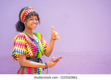 Image Of Beautiful African Lady With Smart Phone And A Thump Up Sign- Communication Concept