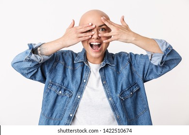 Image Of A Beautiful Happy Bald Woman Posing Isolated Over White Wall Background Covering Face With Hands.