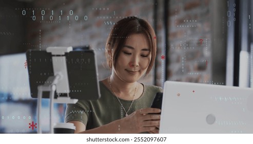 Image of binary coding data processing over caucasian businesswoman in office. Global finance, business, connections, computing and data processing concept digitally generated image.