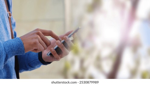 Image of biracial businessman using smartphone on blurred background. Global business and digital interface concept digitally generated image. - Powered by Shutterstock